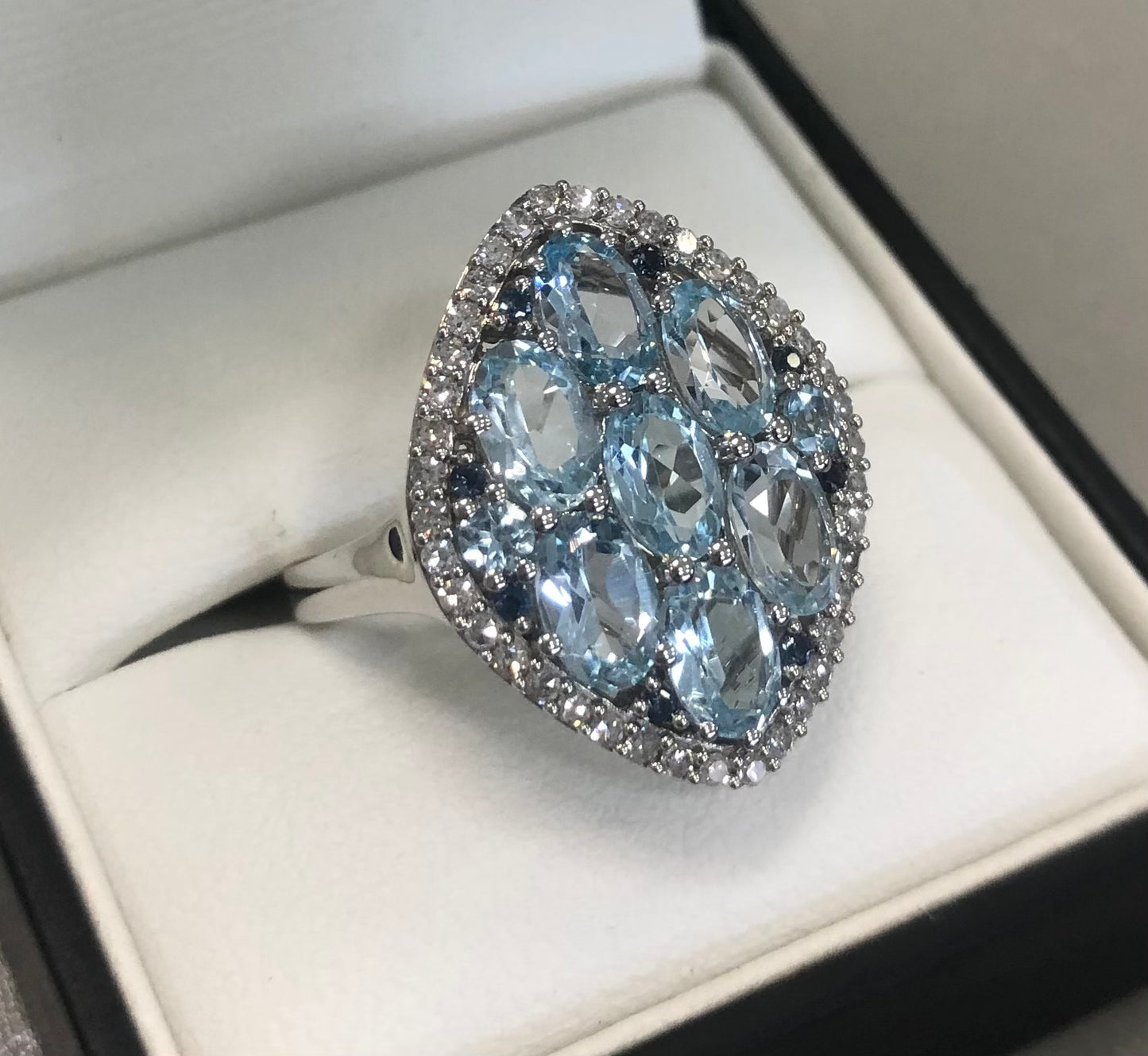 Sky Blue Topaz & Blue Sapphire Ring with Diamond Halo