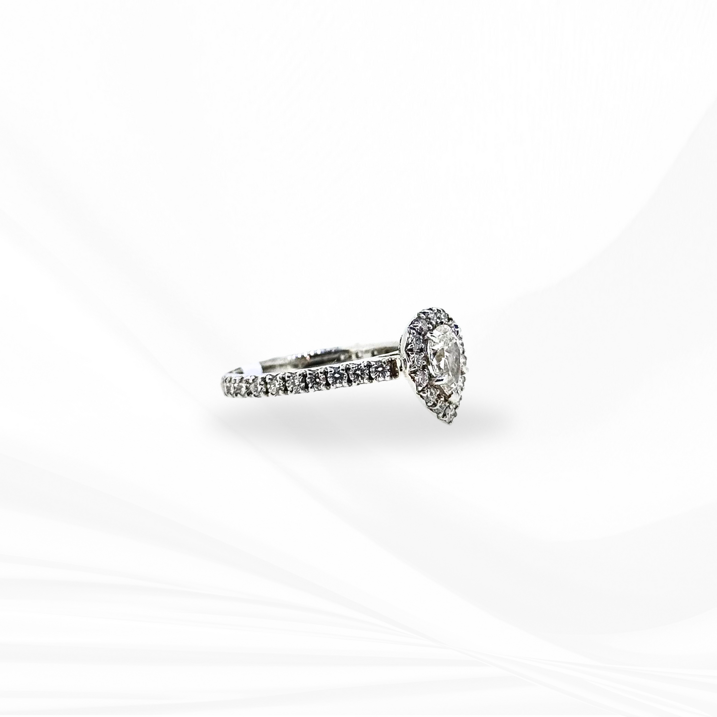 Pear Natural Diamond with a Halo Engagement Ring